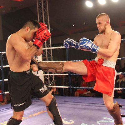 Patron hits home with a good front kick to Salman at the International kickboxing event in Belfast 