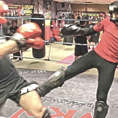 Salman Shariati takes a low-kick from Rafa del Toro during a sparring session at the ProKick Gym