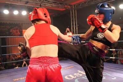  Kerry Doyle  takes a hard road kick doing the WKN irish title fight from rowena Bolt