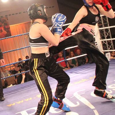 Grace Jump Round Kick lands to Jade Molloy at the Stormont Hotel on Saturday 17th FEB 2018