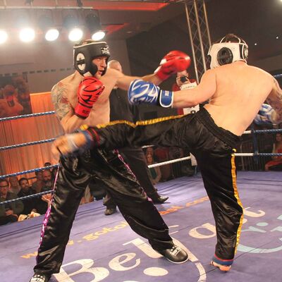 Bryan Bitter ( Yamabushi, Switzerland) lands a Round Kick to Belfast's Matthew Kerr