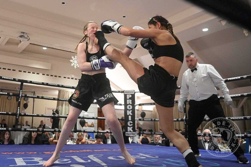 Grace takes a hard front Kick to the face.  Grace faced experienced German Kubra Akdut for the WKN Bantamweight European title.