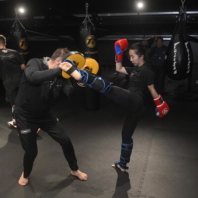 ProKick's Billy Murray helps Yuko Koshikawa, with her high kick at the iconic new ProKick gym.