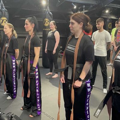 Their brown belts were undone and their new black belts were tied around their waist by Mr Murray with smiles, tears and loud sighs of relief all round.