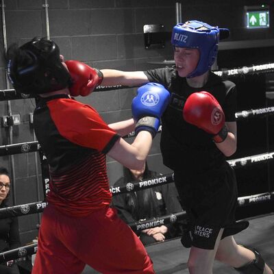 Max Murray 13yrs (ProKick) landing a right hand to Nathan Ewing 14yrs (Golden Dragon, Loop). The match was a WKN Low-Kick Light-Contact Rules 2x2 Min Rounds 60.kg