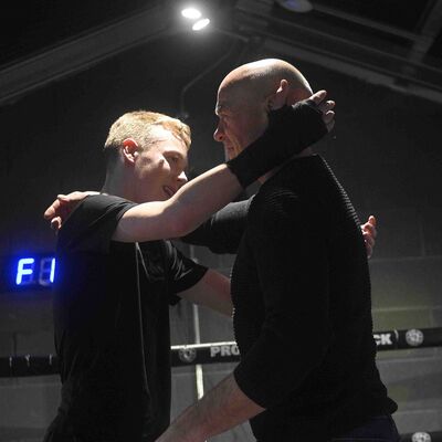 Max Murray gets a hug from his Grandfather, John Murray triple weight Ulster senior boxing champion and all Ireland kickboxing champion all in the 80's - well done to Nathan Ewing 14yrs (Golden Dragon, Loop) for a competitive Light-Contact match.