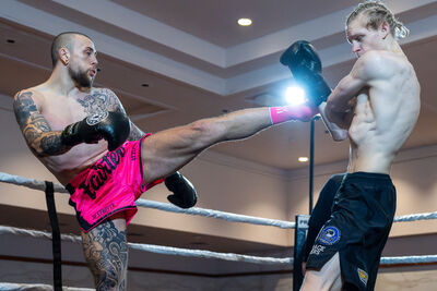James Braniff from Northern Ireland is fighting Brent Spiteri from Malta at the Stormont Hotel in Belfast. The fight begins with Spiteri landing a round kick to Braniff's midsection.