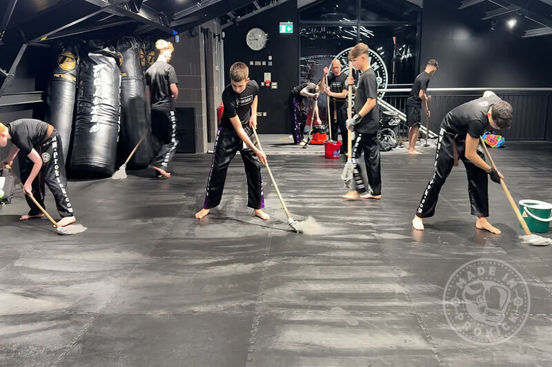 Staying humble and helpful, the team diligently cleaned up after day two of the ProKick Black Belt event on Tuesday, 16th December 2025.