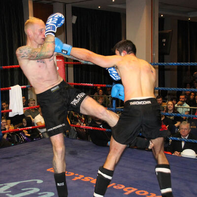 McMullan lands a kick and Nikos Kollias from (Cyprus) lands a punch