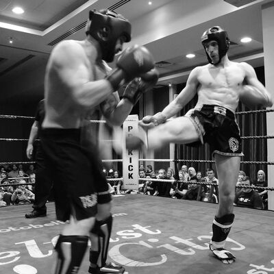 David McCormack lands a hard low lick to the leg of  Martin Carson in Belfast