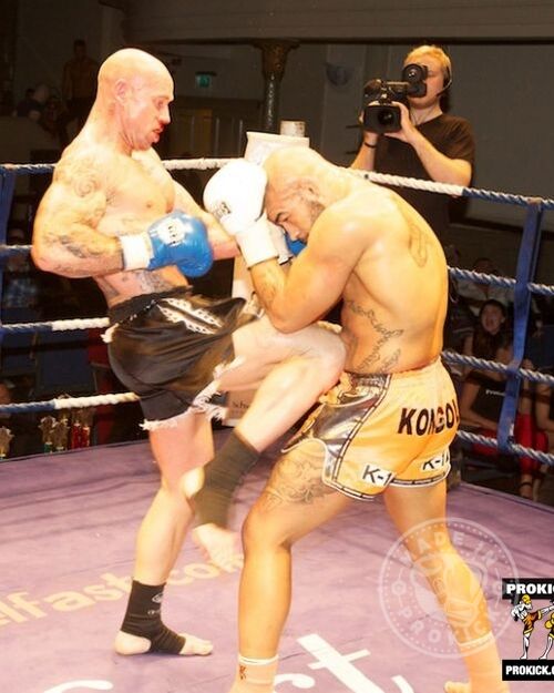 Action as Yohan Kongolo takes a knee from Aidan Brooks at KickMASS 2013 at the Ulster Hall in Belfast