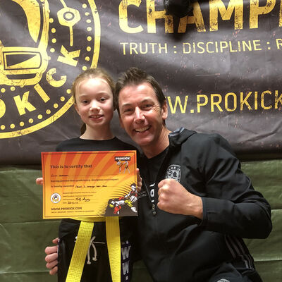 Daddy's Girl hit Gold - Erin Dobson is all smiles after obtaining her orange belt but the biggest smile belongs to her Dad  senior ProKick brown belt Mr Paul Dobson 'A Proud Dad'