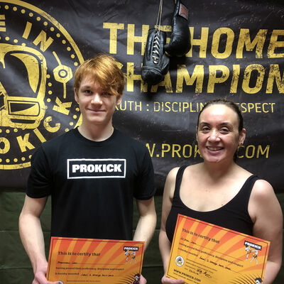 Mrs Lam and Son Matthew train together at the ProKick gym, well done you two on passing your orange belts.