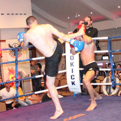 Johnny Swift Smith fires a high kick Christos Venizelou (Cyprus) At the Stormont Hotel Saturday 23rd Feb 2019