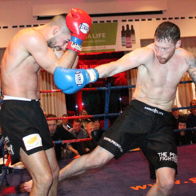 Swift Smith shoots a Low Kick to Christos Venizelou (Cyprus) At the Stormont Hotel Saturday 23rd Feb 2019