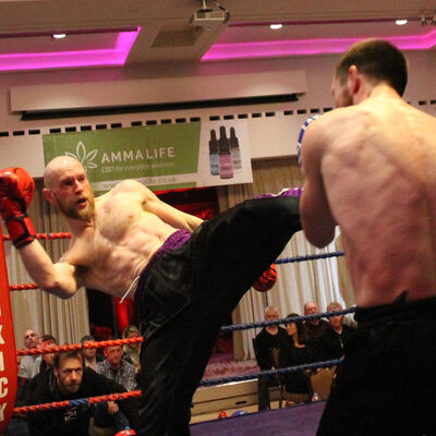 Matthew Kerr fires back with a round kick in his International Full-Contact 3x2 match was made at 71kg