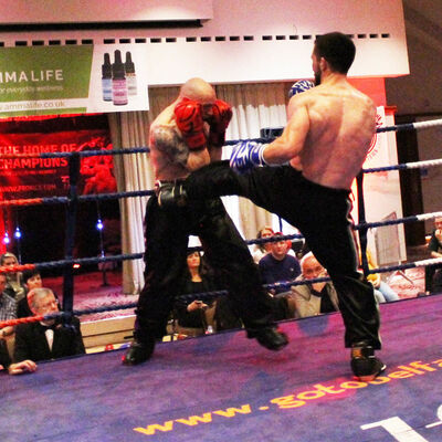 Kerr takes a kick in his International Full-Contact 3x2 match was made at 71kg between Matthew Kerr (Belfast, NI) Vs Thomas Poullain (Switzerland).