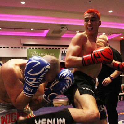 Killian Emery fires a Jumping Back Kick to the body of Shane Weir in Belfast's ProKick event at the Stormont hotel