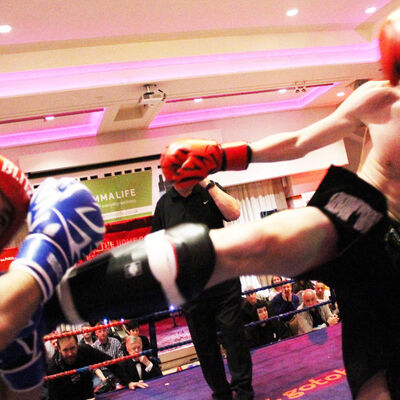 Jay fires a round kick to Charalambous - Two young teenagers showed they belong on the big stage after a non-stop treat in K-1 Style kickboxing matched at 56kg Jay Snodden (Dundonald, NI) faced Nikolas Charalambous of (Cyprus) over 3x2 minute rounds.