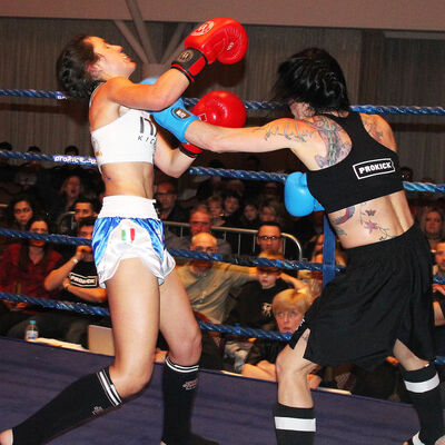 Rowena lands another punch Italian Maura Scano in their low-kick style match at the Stormont hotel in Belfast