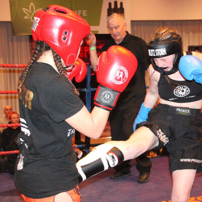 Grace lands a Low-kick to Cypriot Papadopoulouat the Stormont hotel in Belfast on the 23rd FEB 2019.