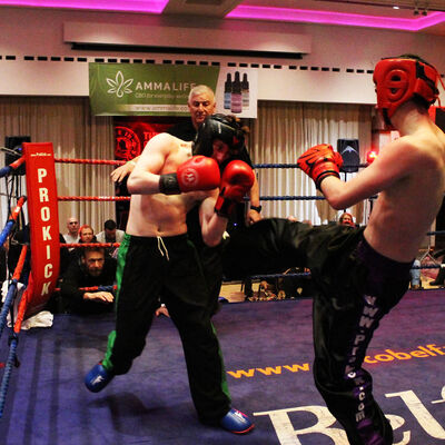 Camryn throws a hard round kick TopRing fighter Bayley Spragg.