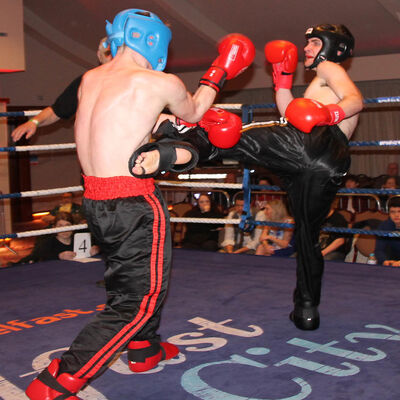 Jack Molloy takes a round kick from Micheal McKay at the Stormont hotel in Belfast at Billy Murray’s ProKick event.