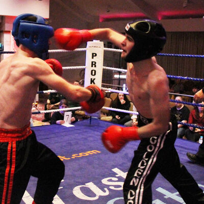 Jack Molloy takes a right hook punch from Micheal McKay at the Stormont hotel in Belfast at Billy Murray’s ProKick event.