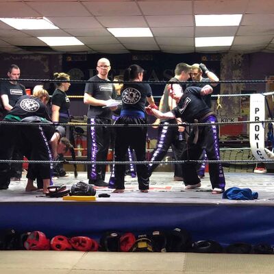 Self-Defence drills - ProKick Seniors working in the ring @ the HQ