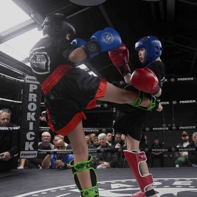 Leo Smith takes a round kick from Dylan Hayes ( Waterford) in their Light Contact K1 rules - 2 x 1.5-minute rounds (no head contact)