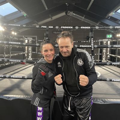 Rowena Bolt (Pictured) with ProKick head coach Billy Murray after receive her Black Belt