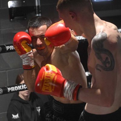 Action with Damiano Vacca as he Punches the WKN Champion Jay Snoddon in their Championship match at the WKN's CFL3 in Belfast