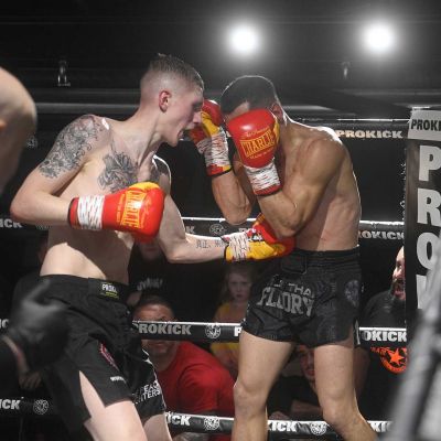 Snoddon puts Damiano Vacca under pressure with body punches in their Championship match in Belfast
