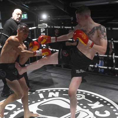 Snoddon Front Kick action with Damiano Vacca as he Punches the WKN Champion Jay Snoddon in their Championship match at the WKN's CFL3 in Belfast