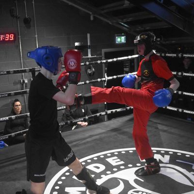 Nathan throws a front kick to Max Murray 13yrs (ProKick)  Nathan Ewing 14yrs (Golden Dragon, Loop). The match was a WKN Low-Kick Light-Contact Rules 2x2 Min Rounds 60.kg