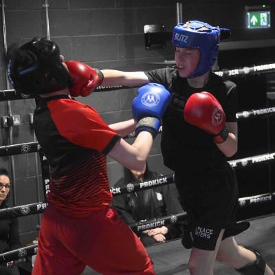 Max Murray 13yrs (ProKick) landing a right hand to Nathan Ewing 14yrs (Golden Dragon, Loop). The match was a WKN Low-Kick Light-Contact Rules 2x2 Min Rounds 60.kg