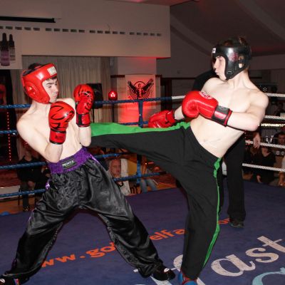 Bayley lands a good round kick to Camryn at the ProKick event Stormont hotel Belfast on the 23rd FEB 2019