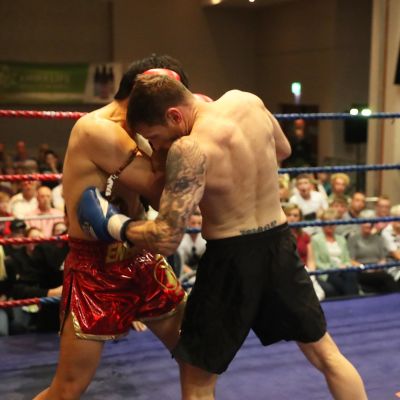 Smith lands a body shot - Jihoon Lee Vs Johnny 'Swift' Smith at the Clayton hotel Belfast on 23rd, June 2019