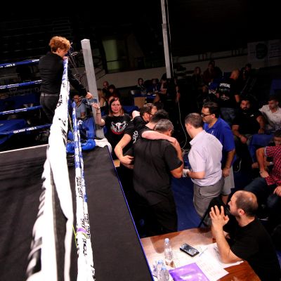 Camryn Brown helped out of the ring by ringside doctors