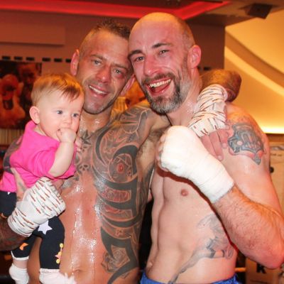 After the battle - Gary Hamilton celebrates his last outing as a fighter with his daughter Evie and tough Scot, Duglas Morrison.