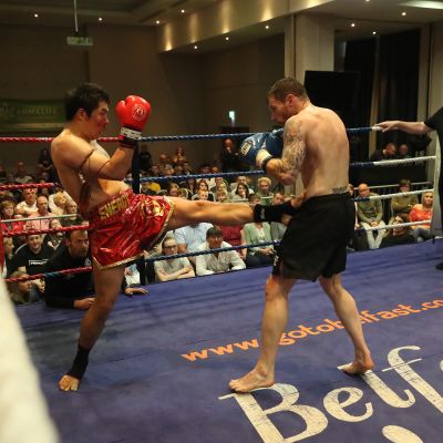 The Korean, Jihoon Lee lands a front kick on Johnny Smith - action from the WKN title match with Jihoon Lee Vs Johnny 'Swift' Smith at the Clayton hotel Belfast on 23rd, June 2019