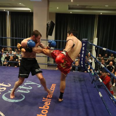Jihoon Lee land a hard round Kick to Smith - action from the WKN title match with Jihoon Lee Vs Johnny 'Swift' Smith at the Clayton hotel Belfast on 23rd, June 2019