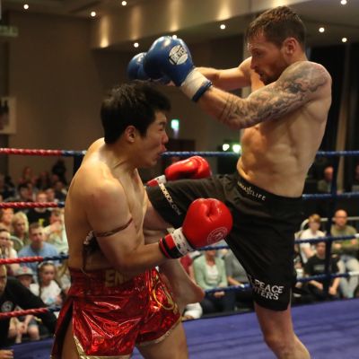 Jumping Knee land to the mid-section, action from the WKN title match with Jihoon Lee Vs Johnny 'Swift' Smith at the Clayton hotel Belfast on 23rd, June 2019